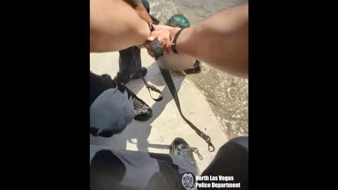 A woman was rescued from rushing water in Las Vegas, a video shows.