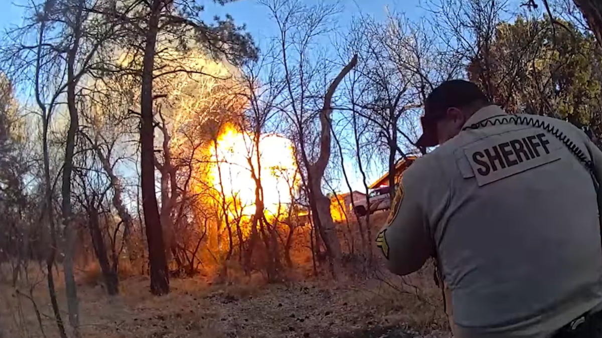 A fiery explosion was caught on camera in Prescott, Arizona, and a 70-year-old man was arrested, police said.
