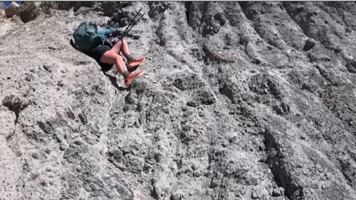 The hiker held her position for over an hour, rescuers said.