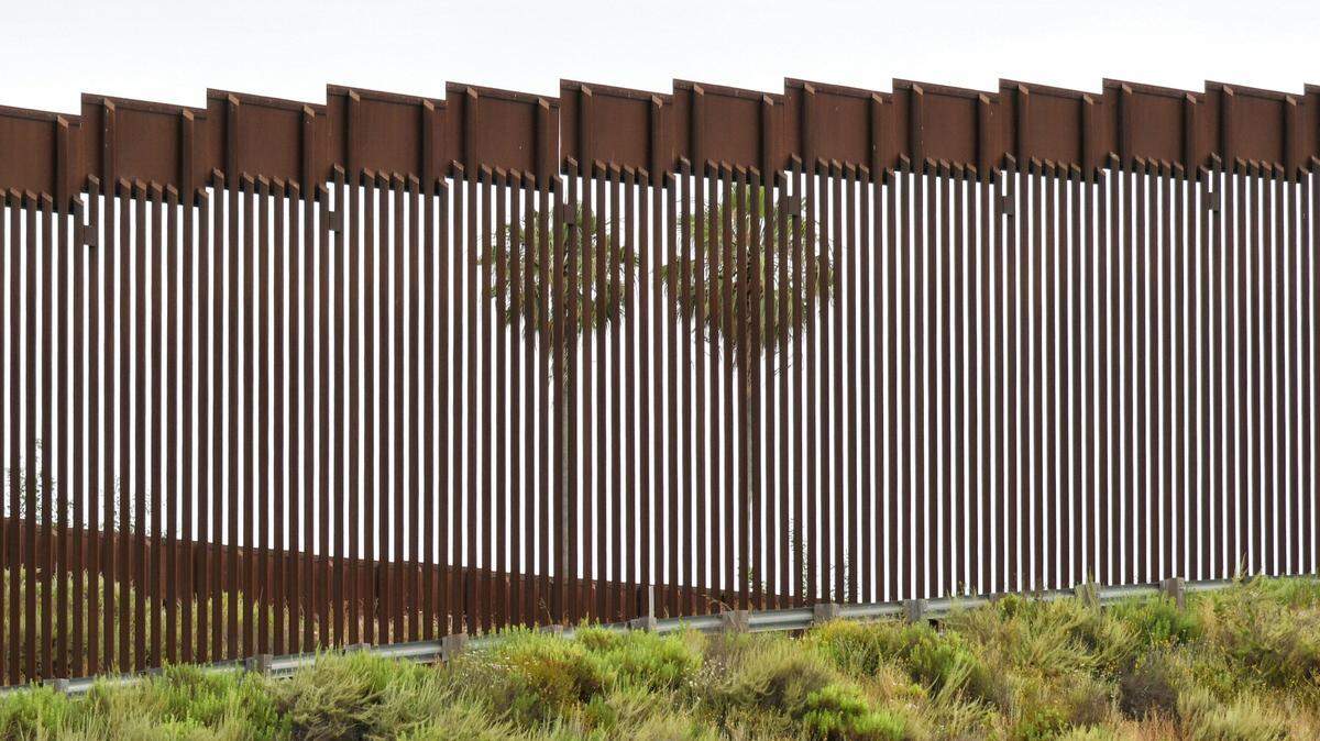 Ten people were taken to hospitals after falling off a 30-foot border wall between the U.S. and Mexico near the Tijuana River Valley, officials say.