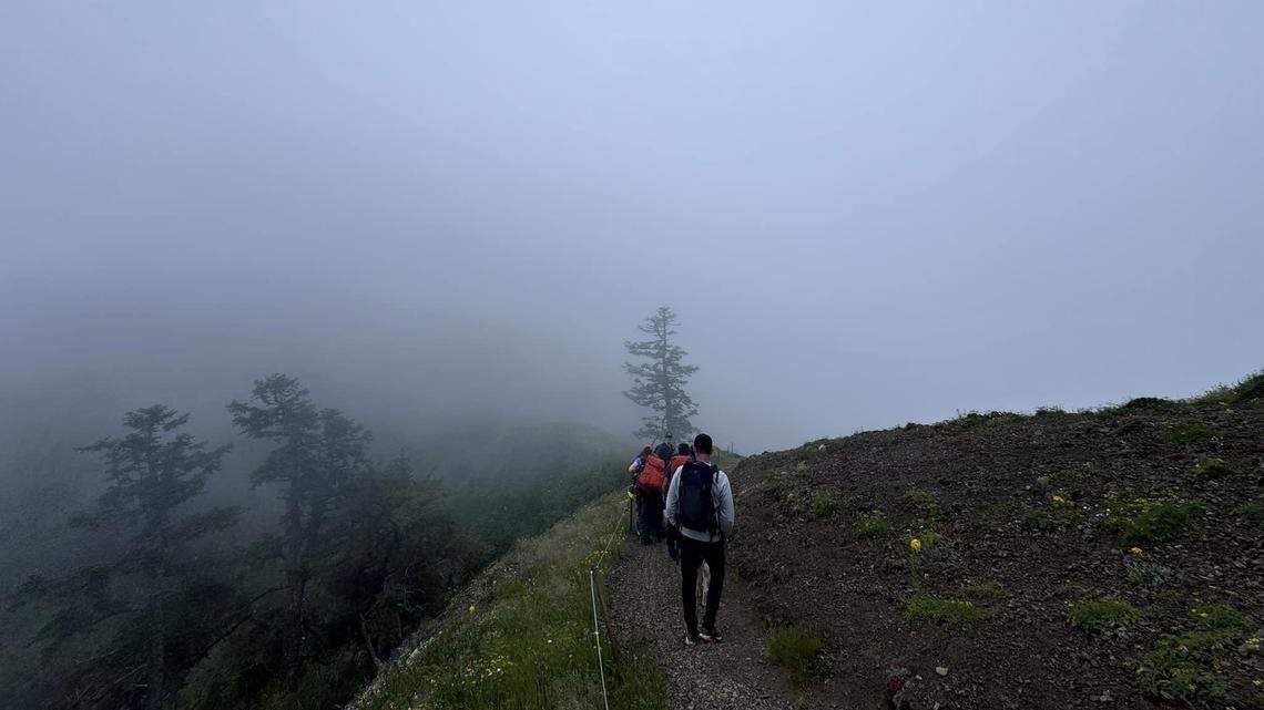 An injured hiker had to be carried down a mountain after weather conditions didn’t let a helicopter assist, Oregon officials said.
