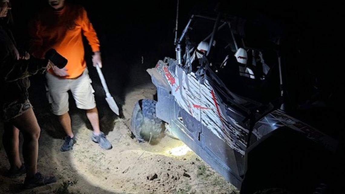 A shovel — and shifting the utility task vehicle into four-wheel drive — helped stranded tourists to safety after they got stuck while driving through soft sand in the Arizona desert.