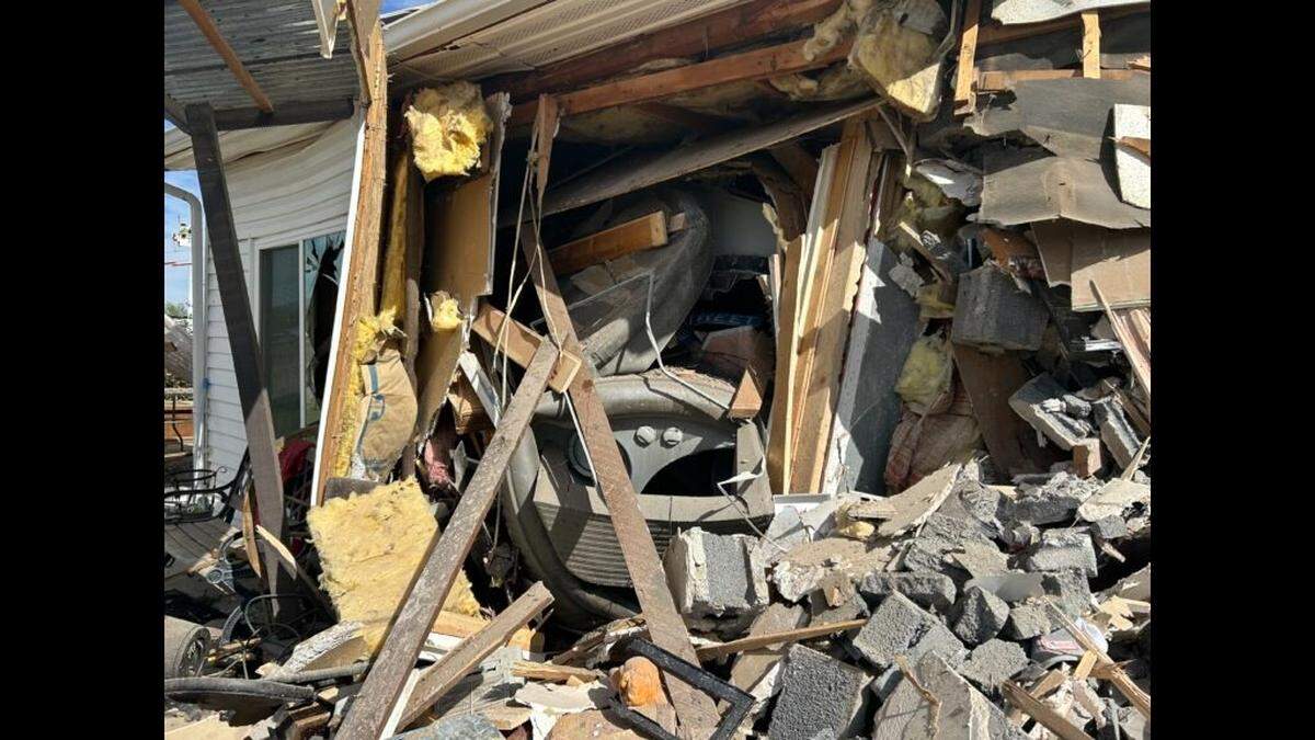 A semi crashed into a Utah home and two people inside were injured, officials said.
