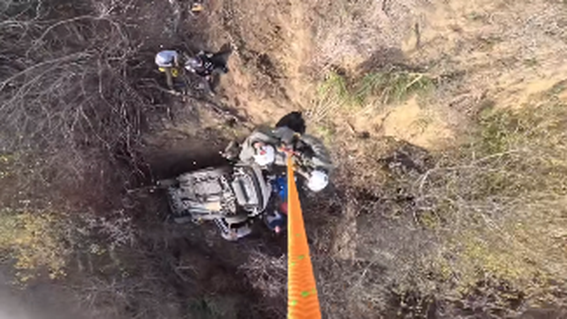 Bystanders alerted rescuers to a vehicle that crashed off a 100-foot cliff into a ravine near Jenner, California cops say.