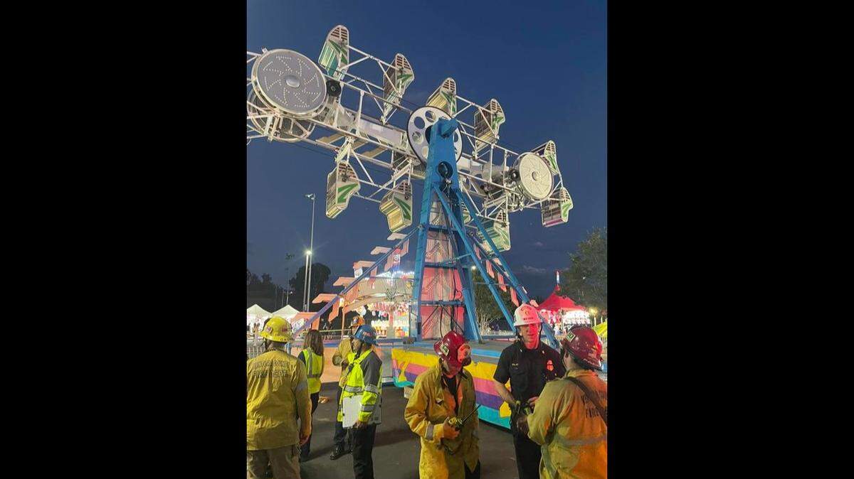 A carnival ride in Thousand Oaks froze up, trapping about 18 riders in midair until they could be rescued by firefighters, California officials say.