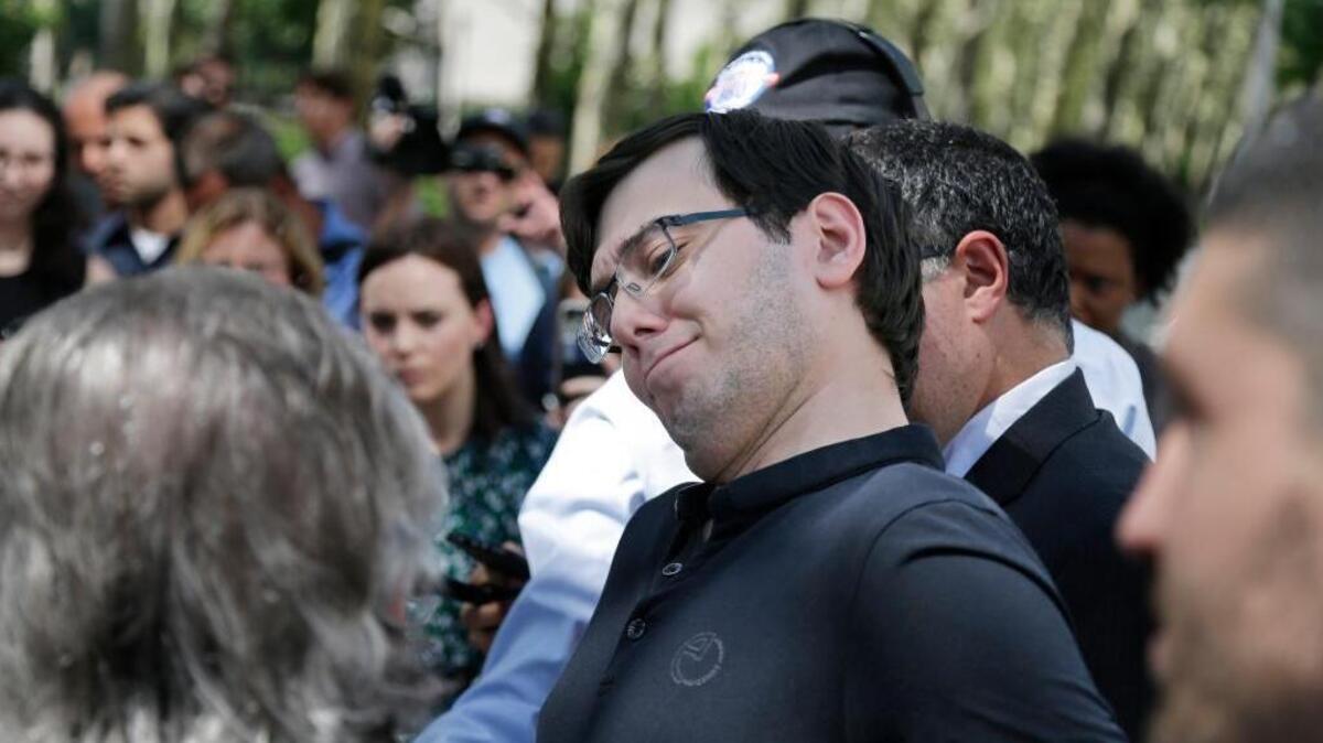 Martin Shkreli makes a face as his attorney Benjamin Brafman talks about his client's reputation while talking to reporters in front leaving federal court in New York, Friday, Aug. 4, 2017. The former pharmaceutical CEO has been convicted on federal charges he deceived investors in a pair of failed hedge funds. A Brooklyn jury deliberated five days before finding Shkreli guilty on Friday on three of eight counts.