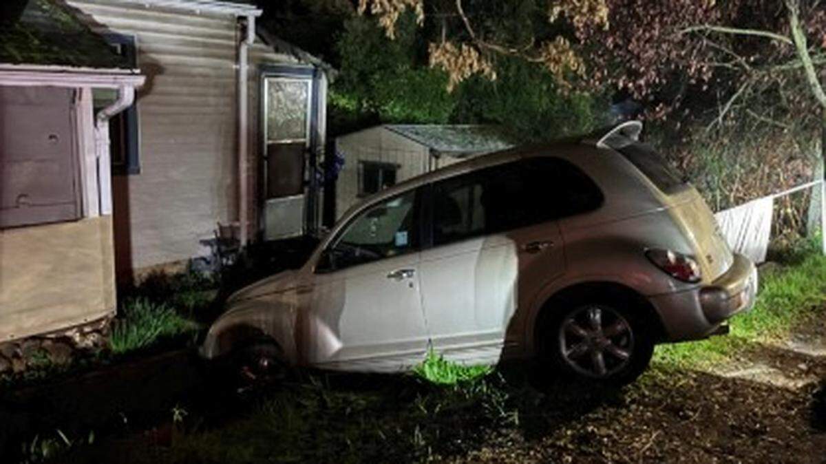 A vehicle had become stuck in a home’s front yard while trying to make a U-turn in heavy fog, police said.