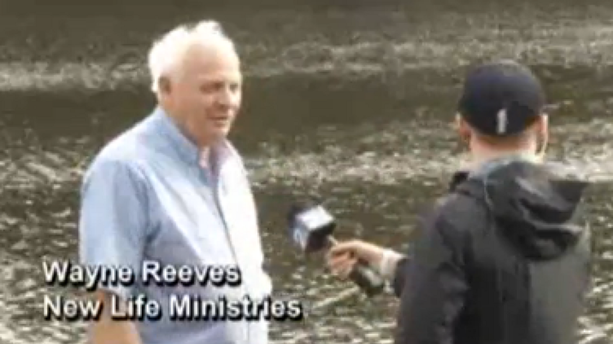 
Pastor Wayne Reeves prepares to retrieve a casket that surfaced in South Carolina floodwaters.
