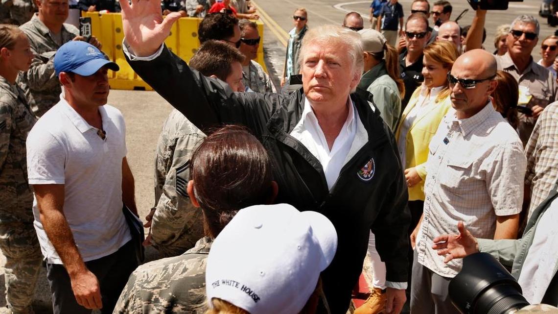 President Donald Trump and first lady Melania arrive at Muniz Air National Guard Base in Carolina, Puerto Rico on Oct. 3, 2017, almost two weeks after Hurricane Maria hit the island.