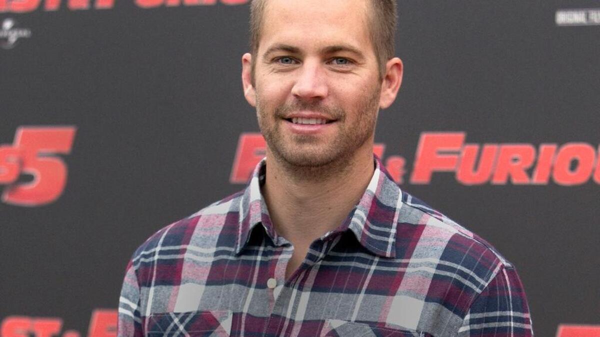 In this April 29, 2011, file photo, actor Paul Walker poses during the photo call of the movie "Fast and Furious 5," in Rome.