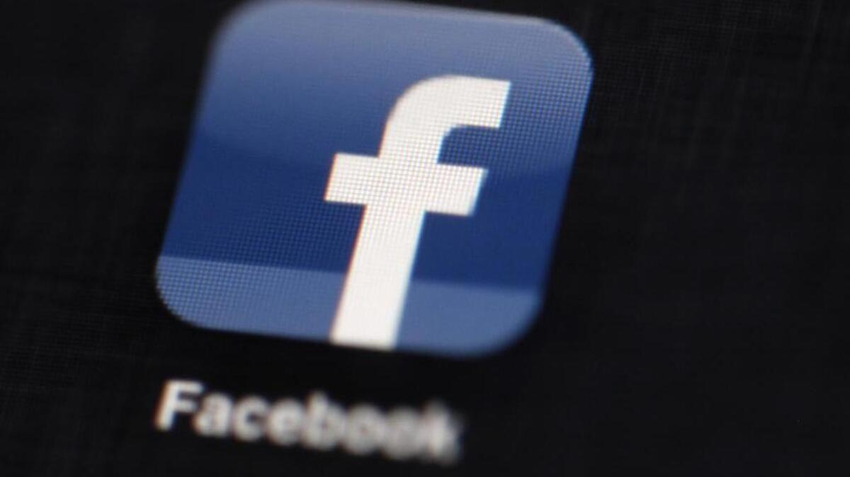 FILE - In this May 16, 2012 file photo, the Facebook logo is displayed on an iPad.