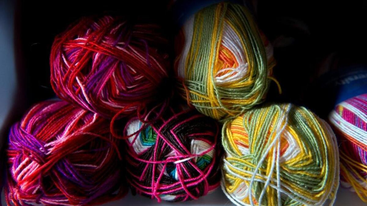 FILE - Colorful yarn sits on a shelf at Lofty Lou’s on Thursday, Dec. 18, 2014 in Placerville, Calif.
