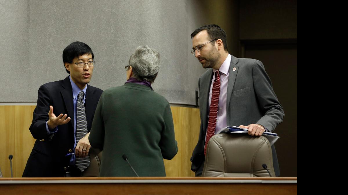 
State Sen. Richard Pan, D-Sacramento, left, talks with Senate Education Committee member Loni Hancock, D-Berkeley, about the concerns she had about the measure he and Sen. Ben Allen, D-Santa Monica, right, co-authored, requiring California schoolchildren to get vaccinated, following a hearing at the Capitol on Wednesday. At the request of Pan and Allen, the committee delayed a vote on the bill to allow them to address some of the issues brought up by committee members. 
