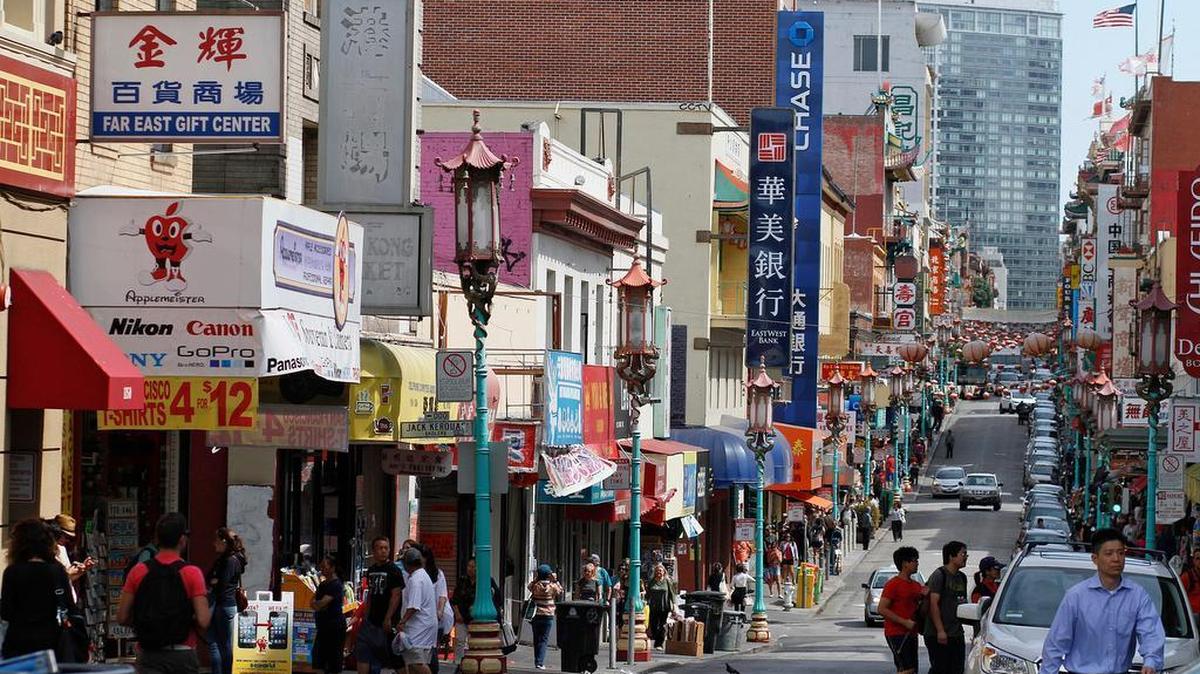 Pedestrians walk in San Francisco’s Chinatown. Emigration from China and other Asian countries has grown largely because of increased demand for highly skilled workers, particularly in the technology industry.