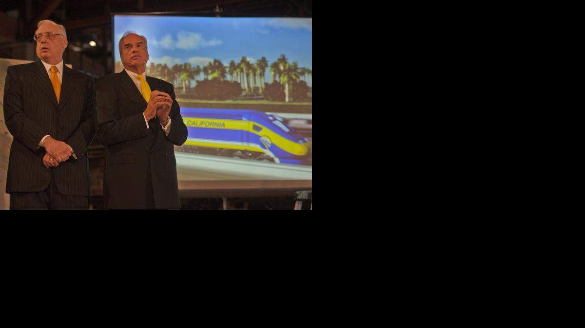 
Dan Richard, left, and Mike Rossi, right, participated in the press conference backing the the California High-Speed Rail system at the California State Railroad Museum Tuesday.
