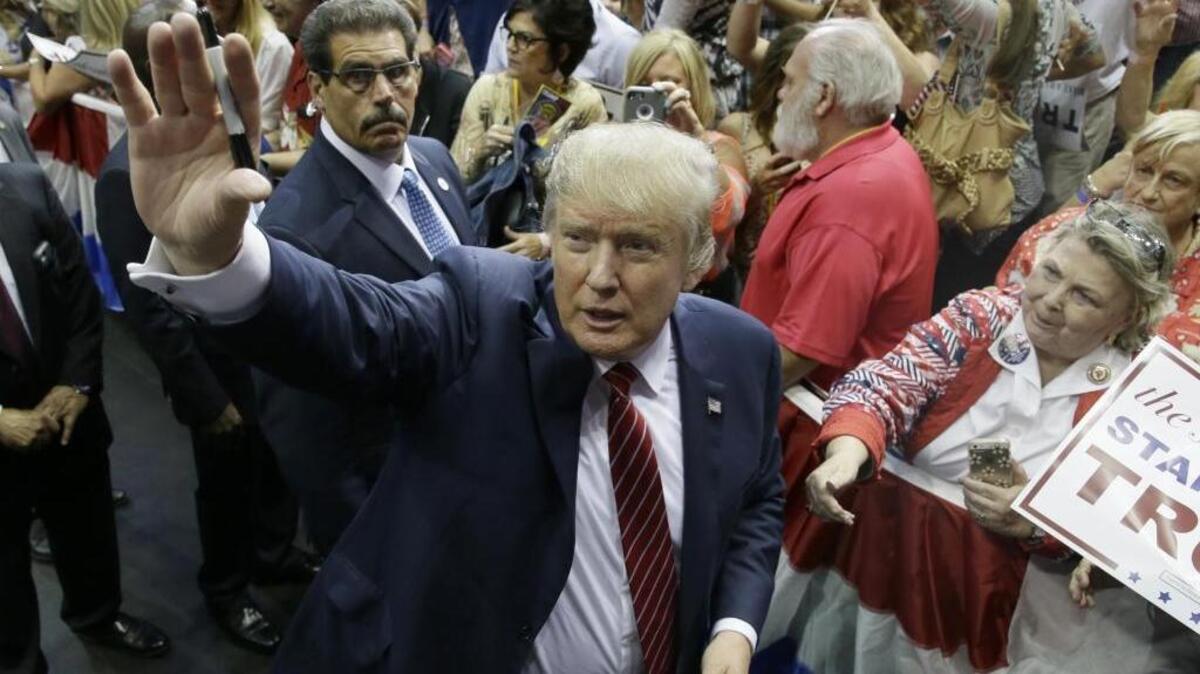 
Republican presidential candidate Donald Trump waves to supporters after speaking at a campaign event in Dallas on Sept. 14, 2015.
