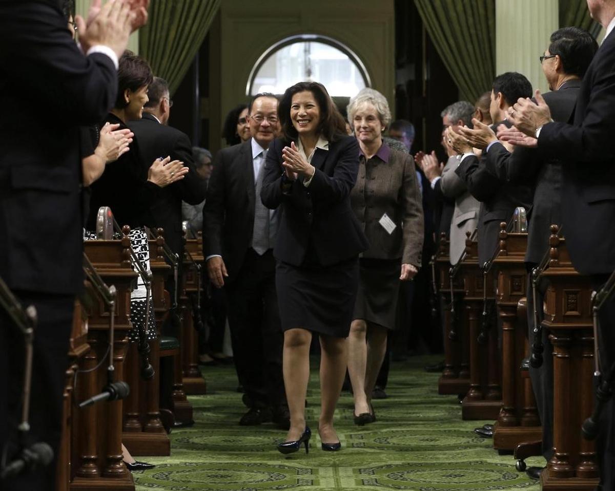 California Supreme Court Chief Justice Tani Cantil-Sakauye returns lawmakers’ applause as she is escorted into the Assembly Chambers to deliver her annual State of the Judiciary address before a joint session of the Legislature at the Capitol in 2015.