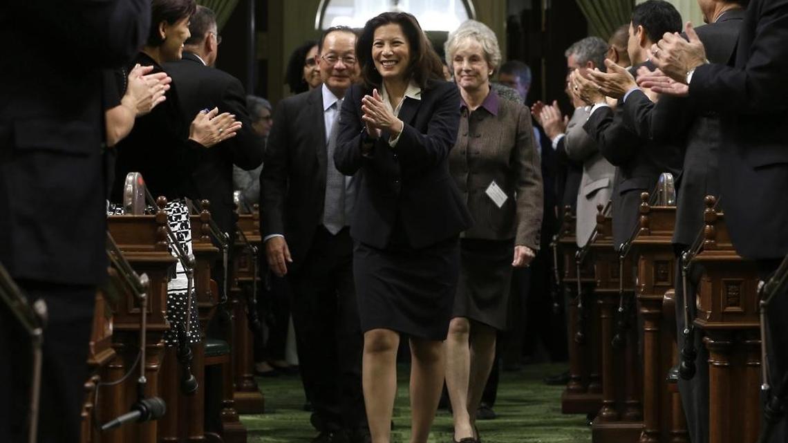 California Supreme Court Chief Justice Tani Cantil Sakauye returns lawmakers’ applause as she is escorted into the Assembly Chambers to deliver her annual State of the Judiciary address before a joint session of the Legislature at the Capitol on March 23, 2015.