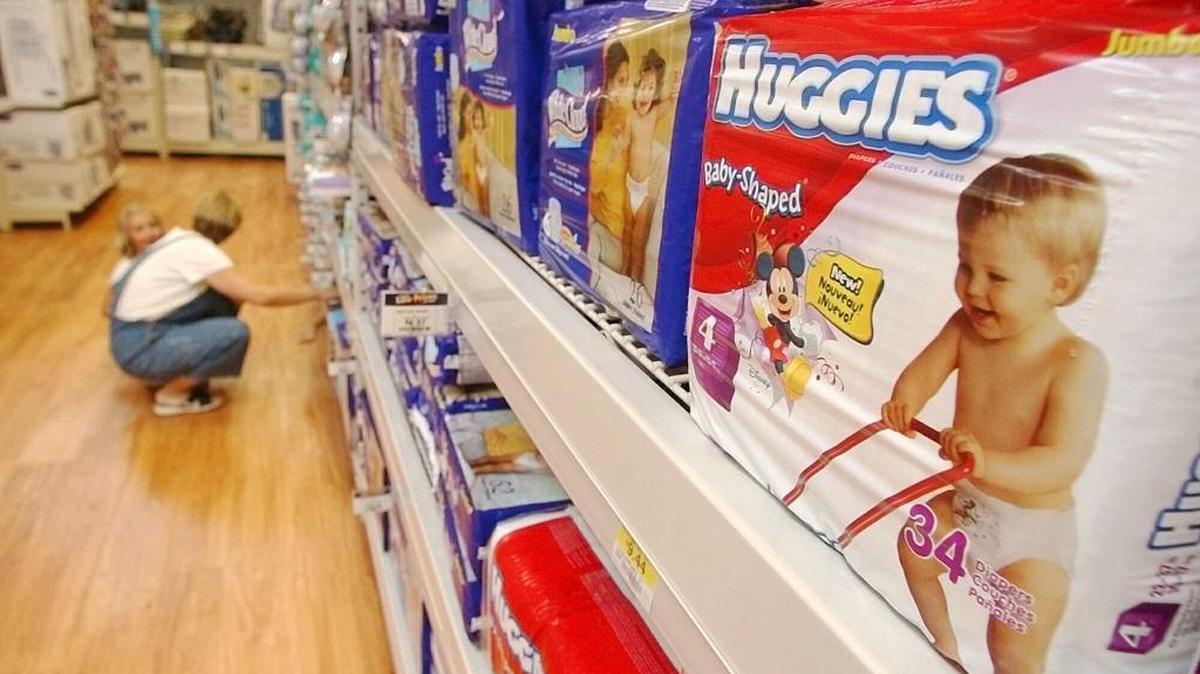 A shopper and her child look at diapers on a store shelf. Both the WA state Senate and House proposed budgets that include funding for diapers for very low income families that receive monthly grants from the Temporary Assistance for Needy Families (TANF) program.