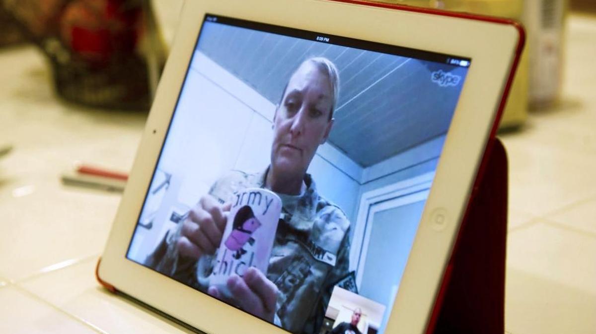 Lori Torres Skypes with her family in Galt while having her morning coffee Thursday, Oct. 10, 2013, while deployed in Afghanistan. She and her husband, Staff Sgt. Troy Torres, both in the National Guard, were affected when their incentive payments were taken back.