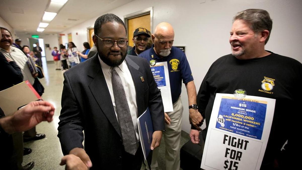 Assemblyman Sebastian Ridley-Thomas, D-Los Angeles, center, walks through a Capitol hallway in 2016. He resigned in December 2017.