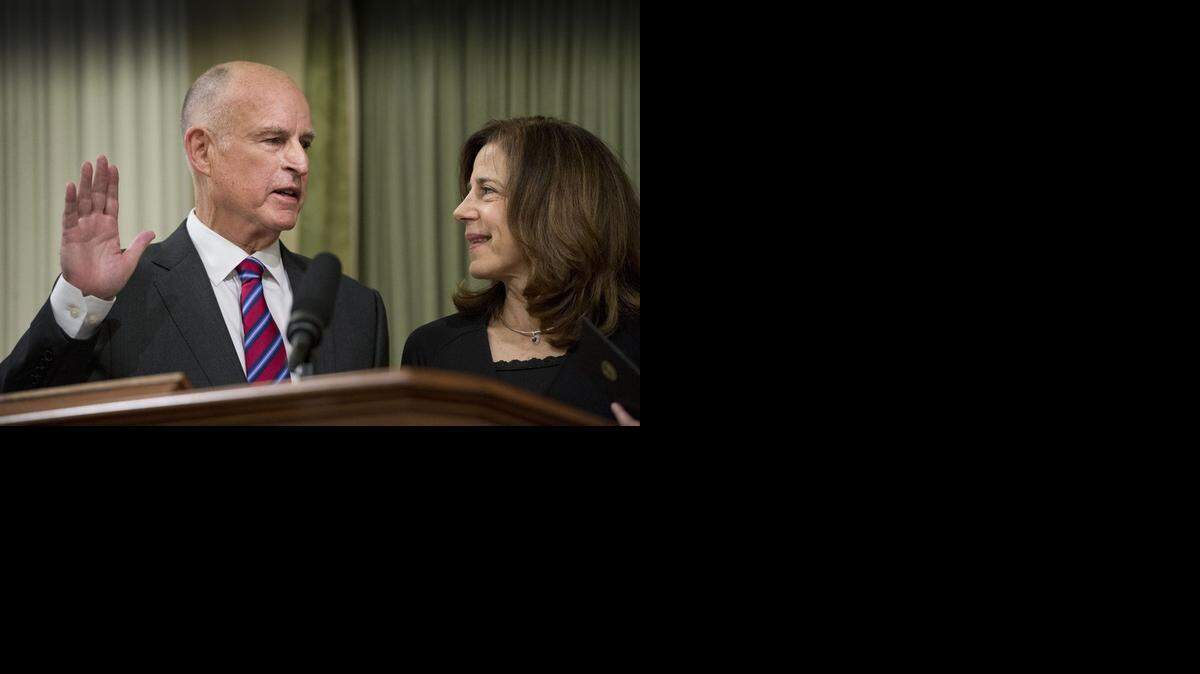 
Gov. Jerry Brown is sworn in to office for the fourth time on Monday, Jan. 5, 2015, as First Lady Anne Gust Brown holds her family bible at the State Capitol in Sacramento.
