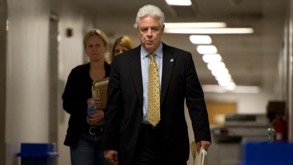 Tony Beard, the Senate’s chief sergeant at arms, escorts FBI agents to Sen. Ron Calderon’s office at the State Capitol in Sacramento on June 4, 2013.