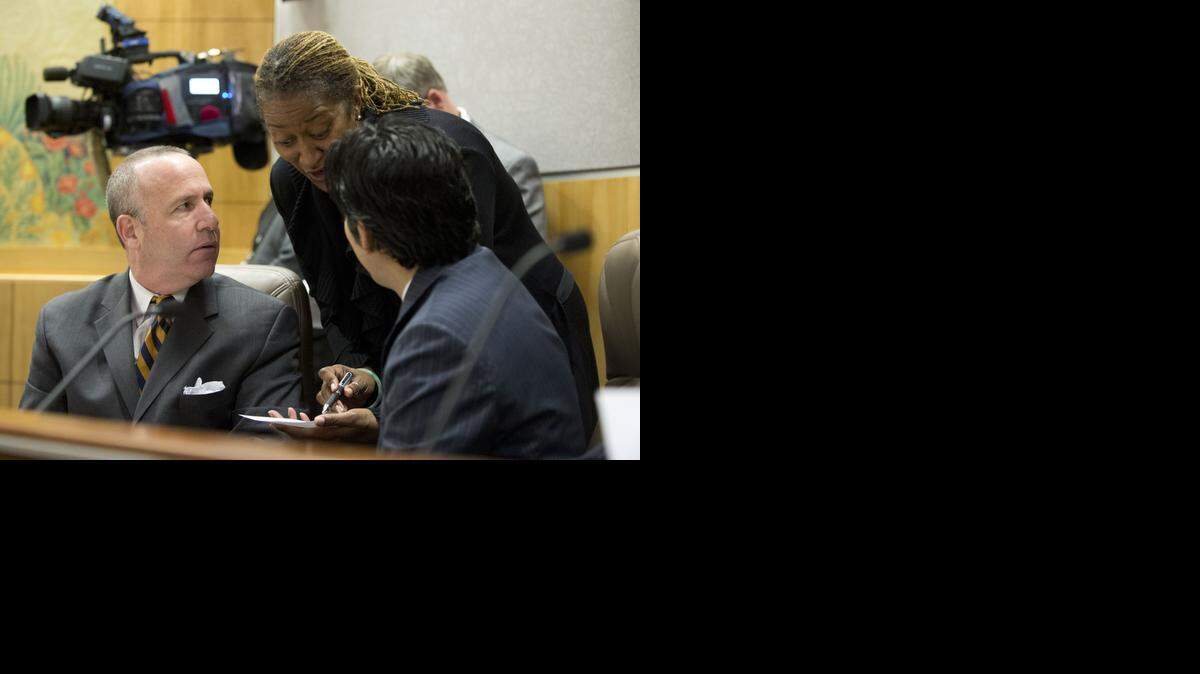 
Sen. Holly Mitchell, D-Los Angeles, talks to then-Senate President Pro Tem Darrell Steinberg, D-Sacramento, and Sen. Kevin de Leon, D- Los Angeles, during a Legislative informational hearing on gun laws on Jan. 29, 2013.
