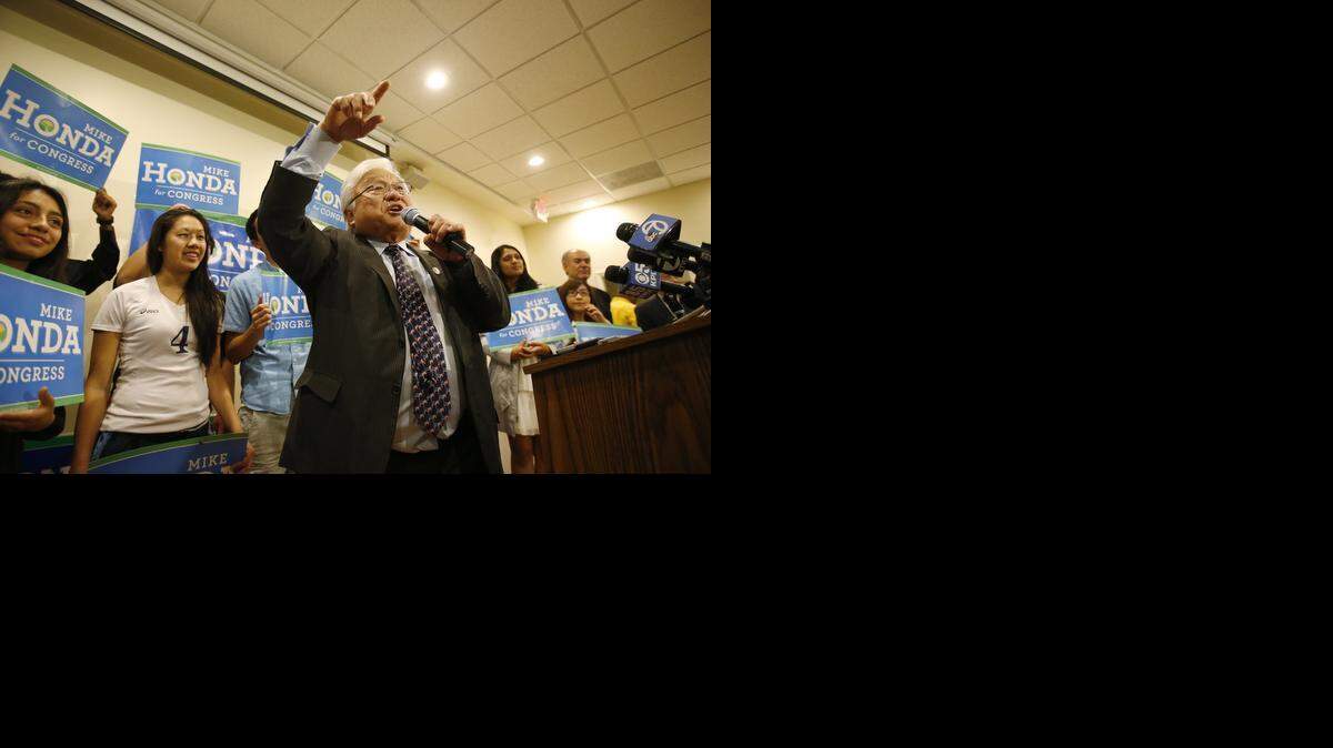
Rep. Mike Honda, D-San Jose, talks with supporters at his election night party at Zahir’s Bistro in Milpitas on Tuesday.
