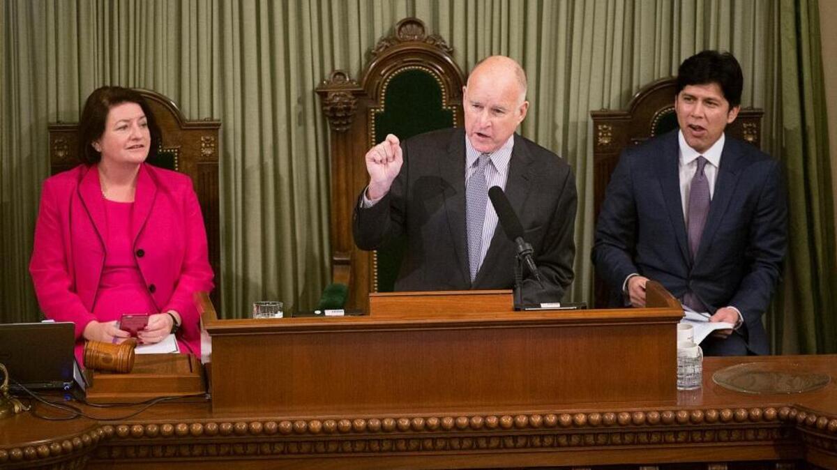 Assembly Speaker Toni Atkins, left, and Senate President pro Tempore Kevin de Leon, right, listen to Gov. Jerry Brown as he gives the State of the State in the Assembly Chamber at the State Capitol on Thursday, Jan. 21, 2016 in Sacramento, Calif.