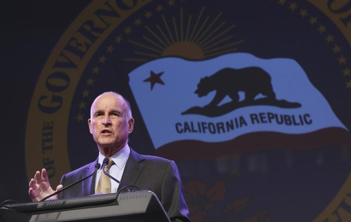 Then-Gov. Jerry Brown gestures during a 2016 community event in Sacramento. Brown was the driving force behind Proposition 57, which gave some inmates early parole opportunities and more chances to shave down their sentences through credit-earning.