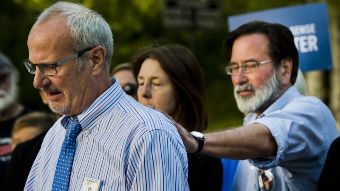 Bob Weiss is comforted by Richard Martinez during a Capitol press conference regarding the “gun violence restraining order” bill on Aug. 27, 2014. Weiss and Martinez both lost children during the Isla Vista shooting this year and have since campaigned for gun control and mental health support nationally.