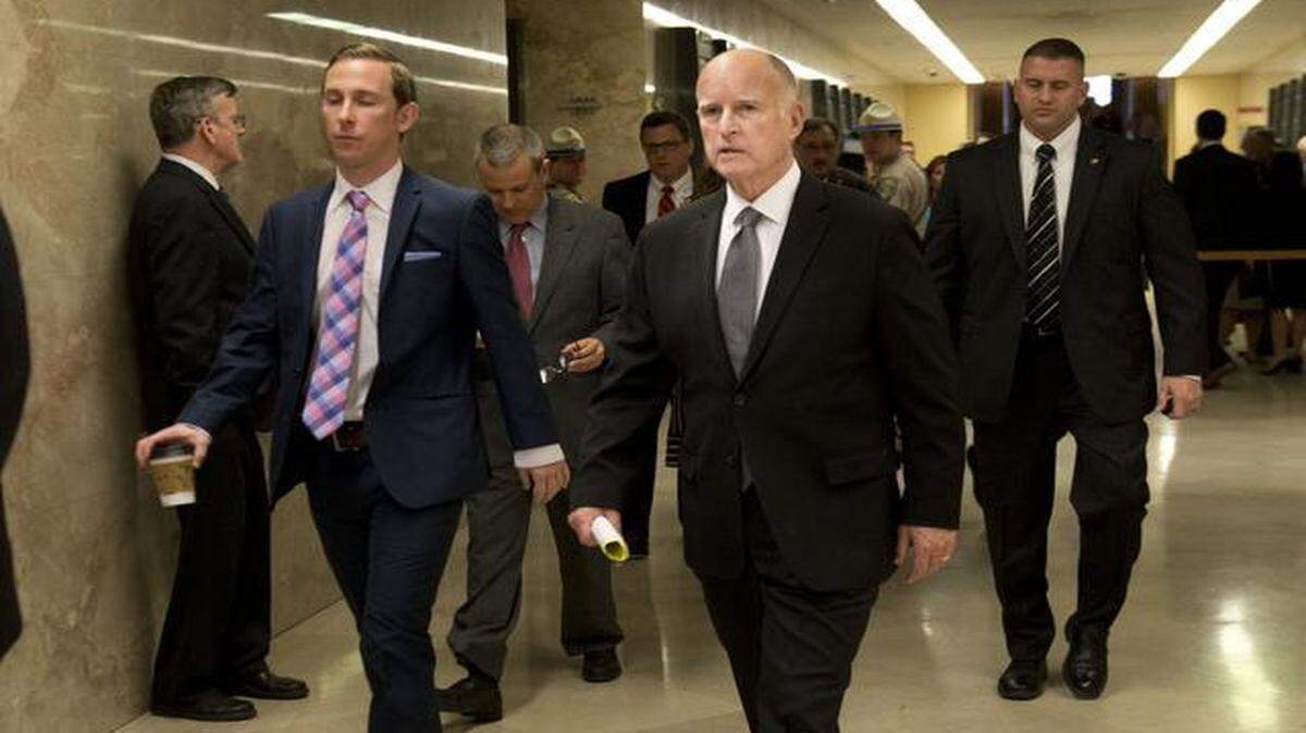 
Gov. Jerry Brown returns to his office after he unveiled the 2015-2016 state budget at the Capitol in Sacramento on Friday, Jan. 9, 2015.
