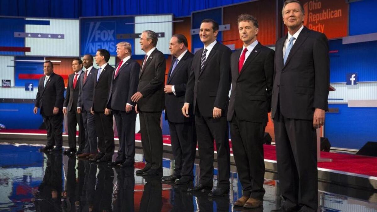 
Republican presidential candidates from left, Chris Christie, Marco Rubio, Ben Carson, Scott Walker, Donald Trump, Jeb Bush, Mike Huckabee, Ted Cruz, Rand Paul, and John Kasich take the stage for the first Republican presidential debate at the Quicken Loans Arena, Aug. 6, 2015, in Cleveland.
