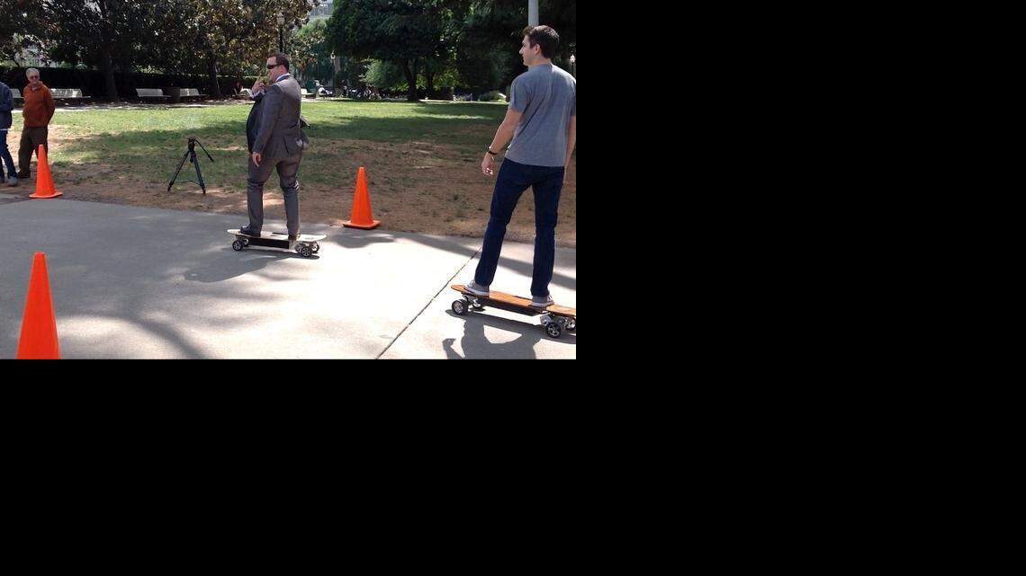 
Assemblyman Devon Mathis, R-Visalia, flashes a peace sign as he rides an electric skateboard at the Capitol Monday.
