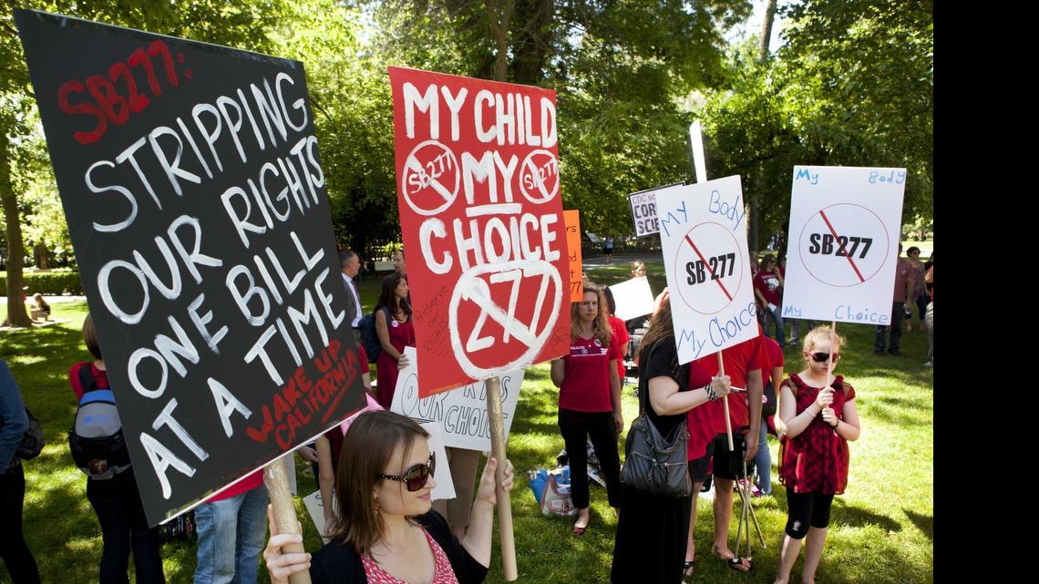 
Protestors opposed to the mandatory vaccination bill, SB277, rally outside of the Capitol before a Senate hearing on the bill on Tuesday, April 28, 2015 in Sacramento.
