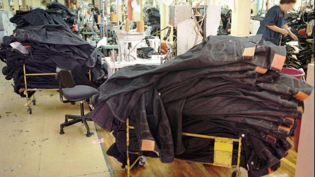 Workers stack Levi's 501 jeans in San Francisco in 1997. Denim is now the state’s official fabric.