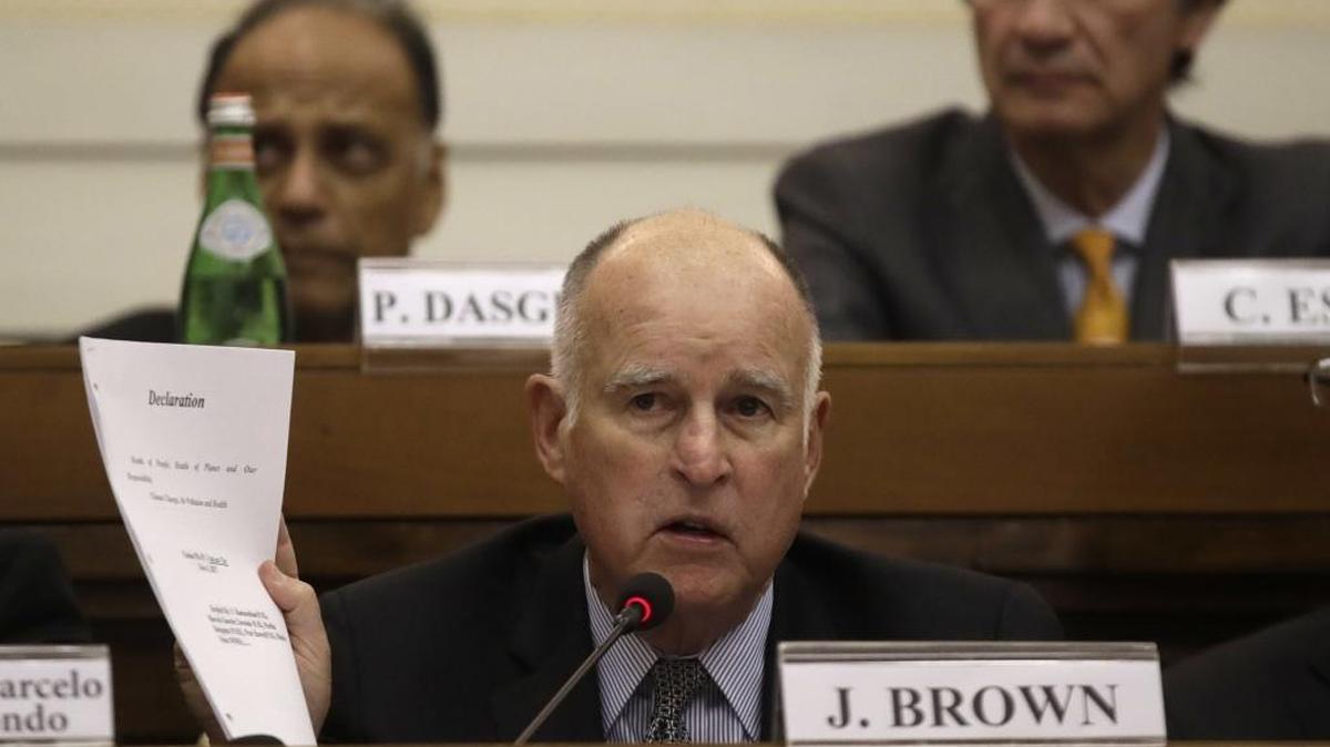 Gov. Jerry Brown shows a paper during a workshop on climate change at the Casina Pio IV at the Vatican on Nov.4, 2017.