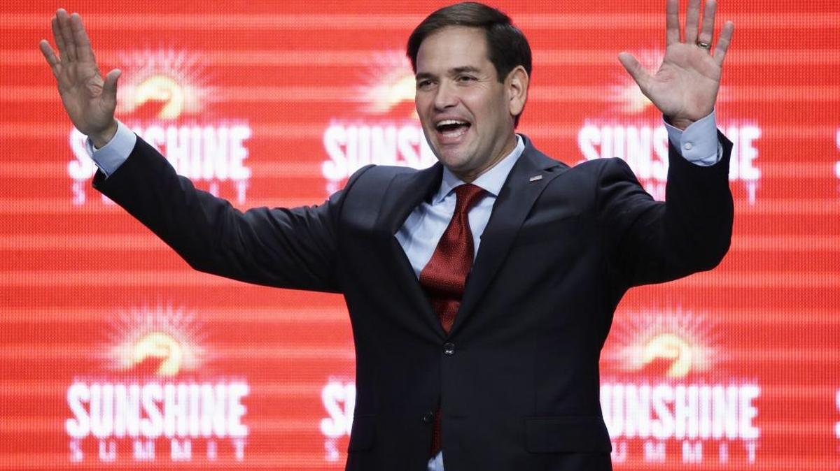 In this Nov. 13, 2015, photo, Sen. Marco Rubio, R- Fla., waves to the audience at the conclusion of his remarks at the Sunshine Summit in Orlando, Fla.