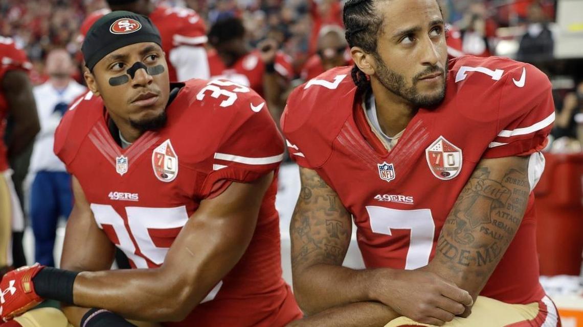San Francisco 49ers safety Eric Reid (35) and quarterback Colin Kaepernick (7) kneel during the national anthem before an NFL football game against the Los Angeles Rams in Santa Clara on Sept. 12, 2016.