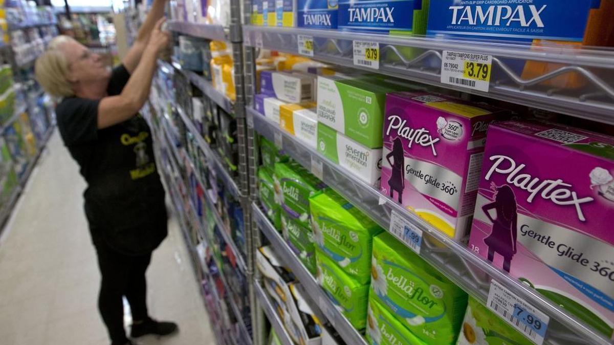 Tammy Compton restocks tampons at Compton's Market in Sacramento on June 22, 2016.