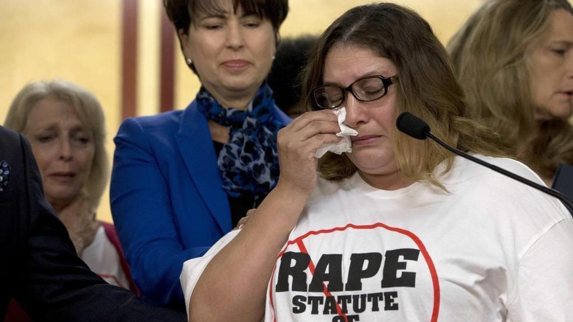 Norma Hernandez wipes her eyes as she talks about being raped when she was 13 during a news conference Tuesday, Sept. 6, 2016, in Sacramento, Calif.with Sen. Connie Leyva, D-Chino.