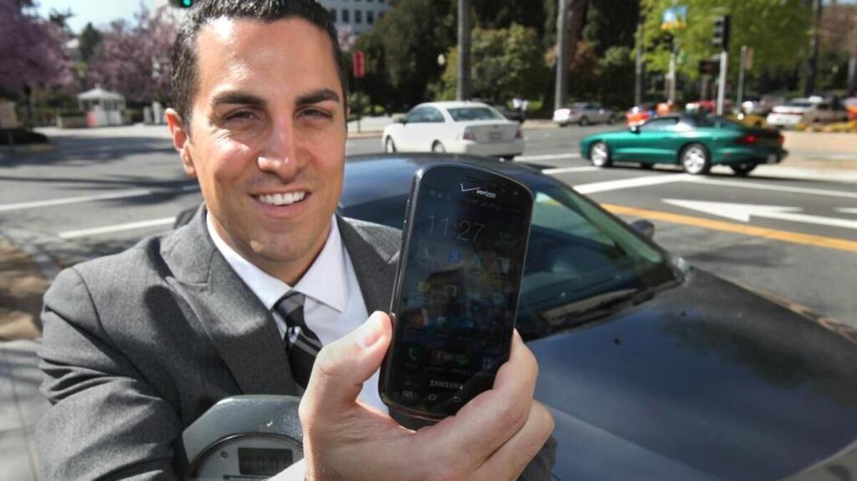 Assemblyman Mike Gatto, D-Los Angeles, displays his cell phone, in Sacramento, Calif. on Monday, Feb. 27, 2012.