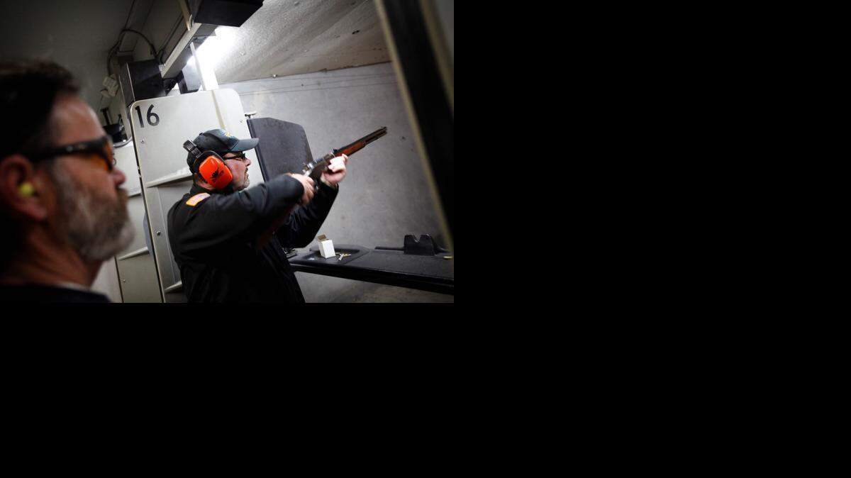 
Staring intently, Tim Donnelly aimed a gun at a paper target bearing the picture of a zombie dressed as a British Red Coat at a gun range in Riverdale, Calif. on Feb. 6, 2014.
