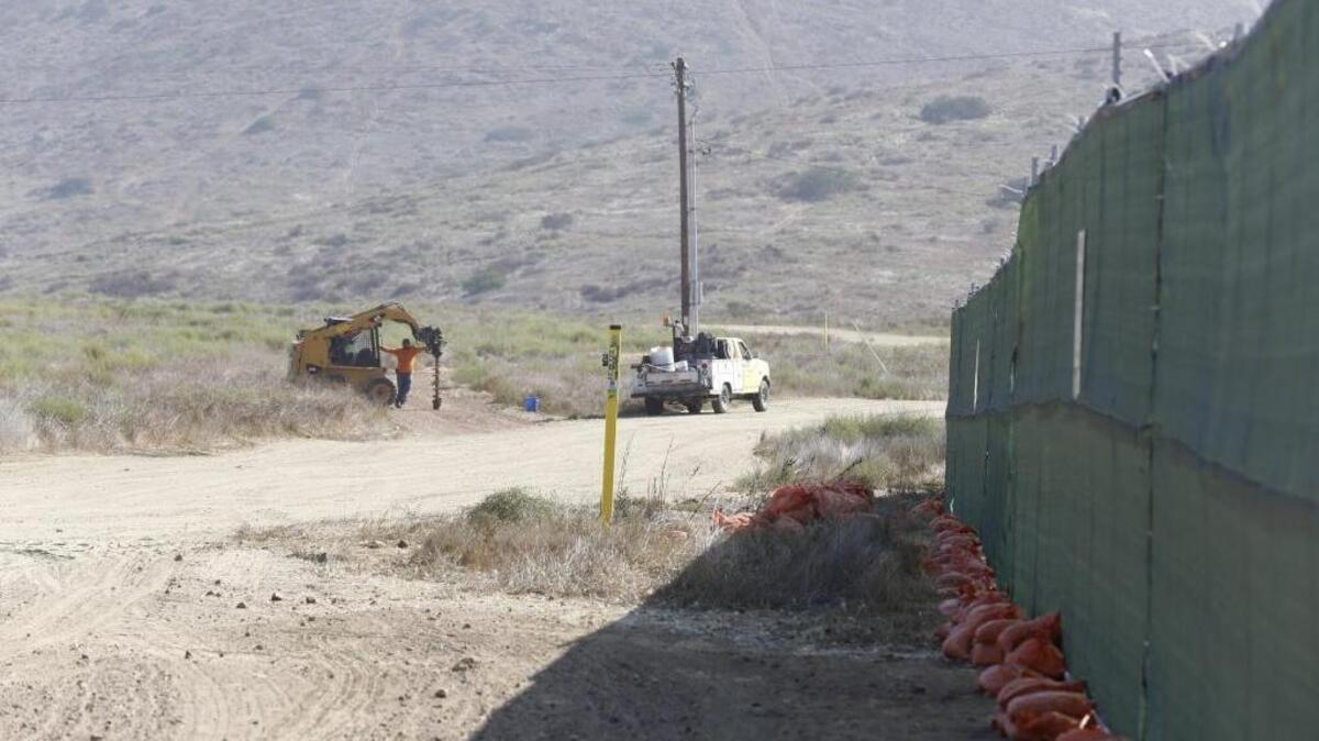 Fences have been put up in the area where border wall prototypes will be built in Otay Mesa, Calif., in May 2017. A coalition of environmental groups on Thursday, Sept. 14, 2017, sued the Department of Homeland Security, challenging the use of sweeping power under a federal law to ignore environmental laws in order to build walls, fences and roads on the border. (Alejandro Tamayo/San Diego Union-Tribune/TNS)