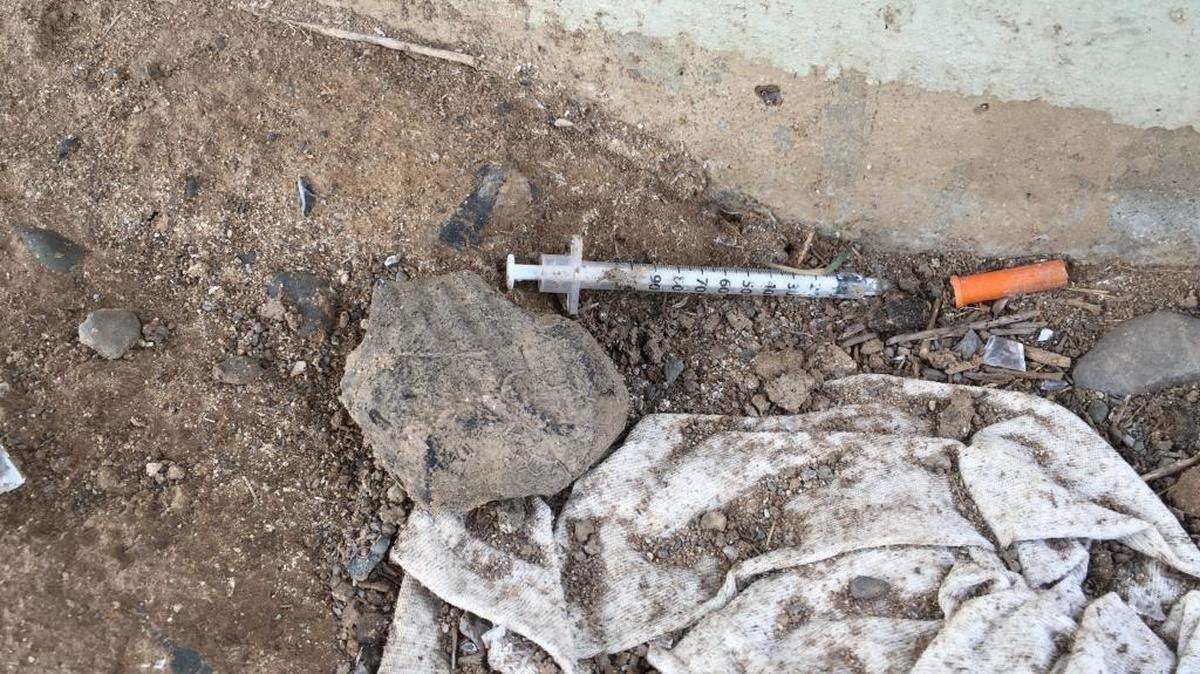 A discarded syringe lies near the railroad tracks between 19th and 20th streets in Sacramento. Nationally, opioid and heroin overdose deaths are way up since 1999.