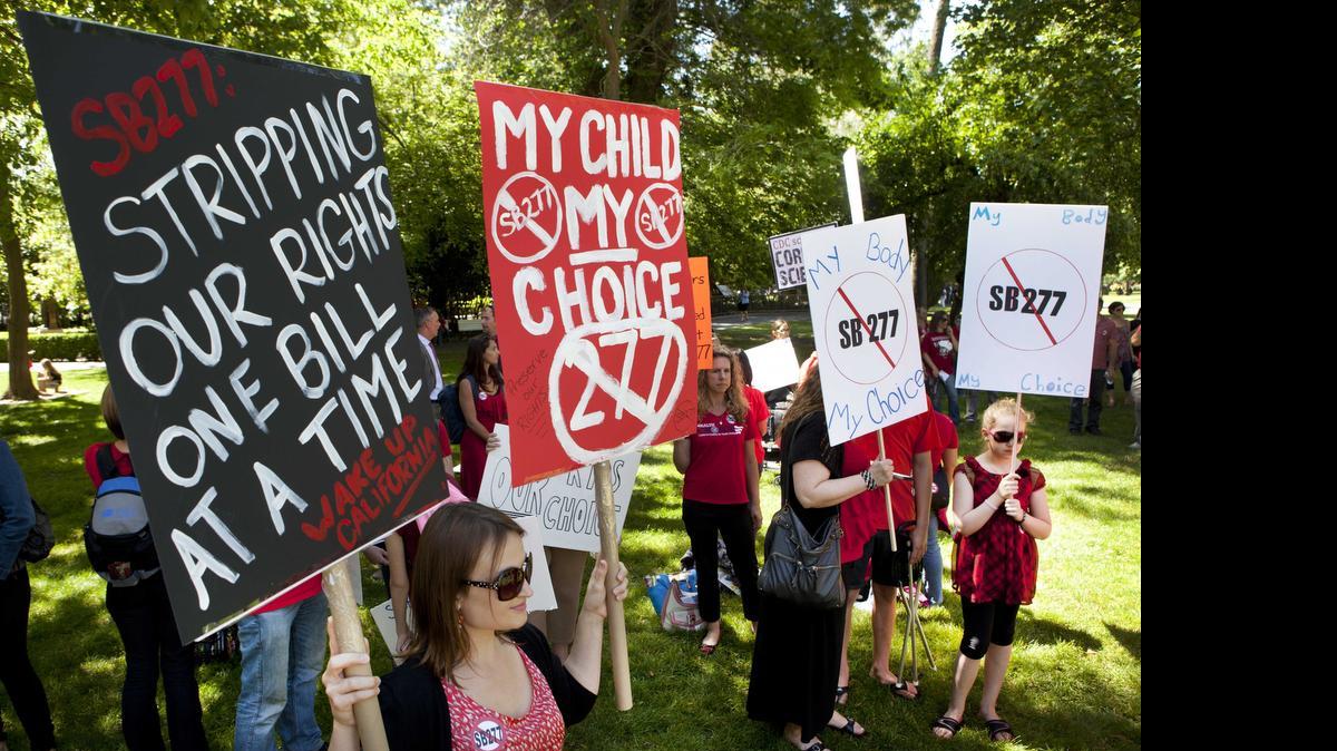 
Protestors opposed to the mandatory vaccination bill SB277 rally outside of the Capitol before a Senate hearing on the bill on Tuesday, April 28, 2015 in Sacramento.
