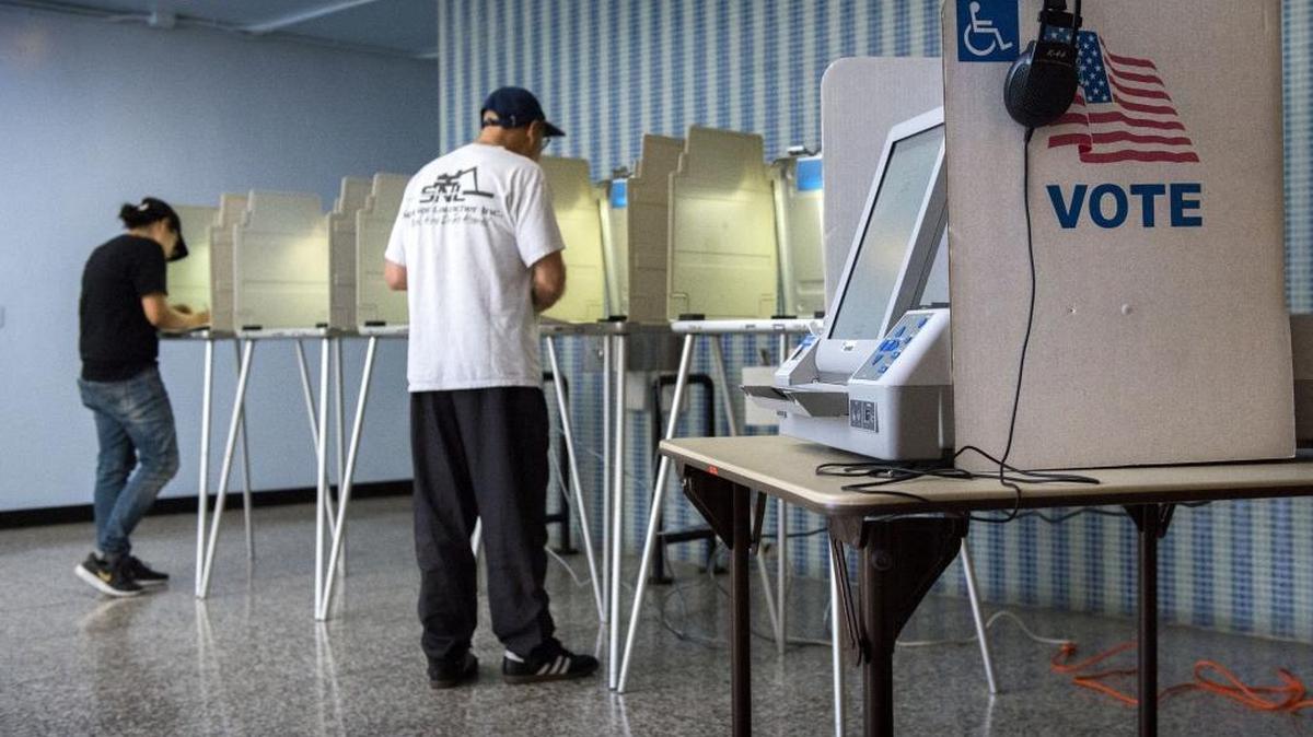 A woman and her father, both of Sacramento, cast their vote at the Luther Burbank High School precinct on Tuesday, June 7, 2016.