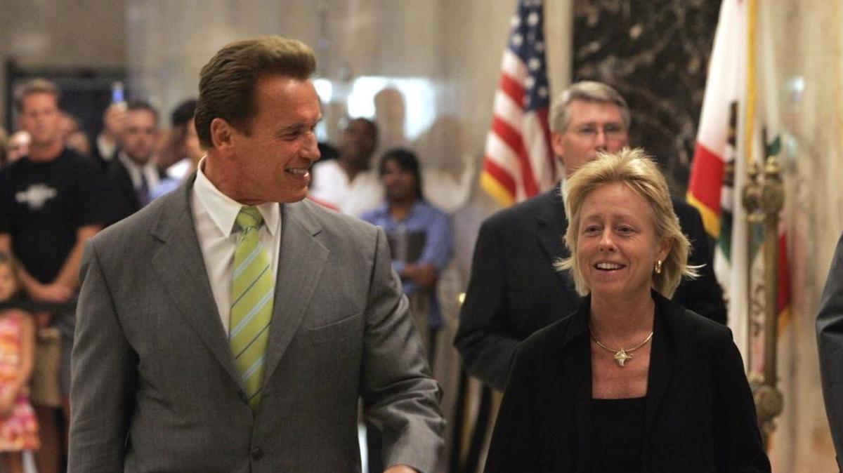 California Gov. Arnold Schwarzenegger, left, walks with his chief of staff, Susan Kennedy, to a Capitol news conference in Sacramento, Calif., Wednesday, Aug. 23, 2006.