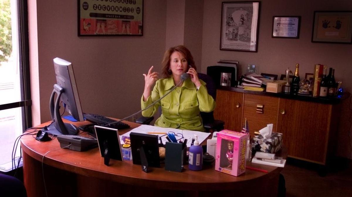 With an Arnold Schwarzenegger “GirlieMan” bobble head on her desk, Gale Kaufman talks on the phone in her campaign consulting firm in Sacramento in 2005. Kaufman has led the campaigns of high-profile current and former legislators and has been inducted into the American Association of Political Consultants’ hall of fame.